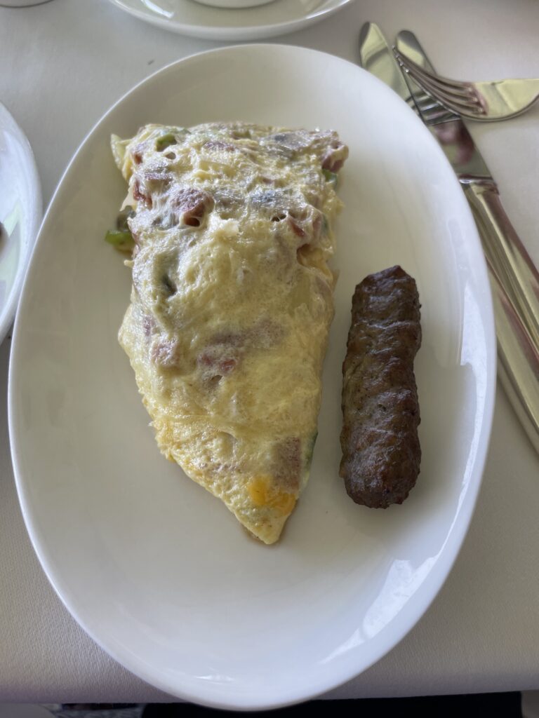 Orchids Breakfast Buffet | Best Brunch In Waikiki Hawaii Calling a plate of food with a fork and knife