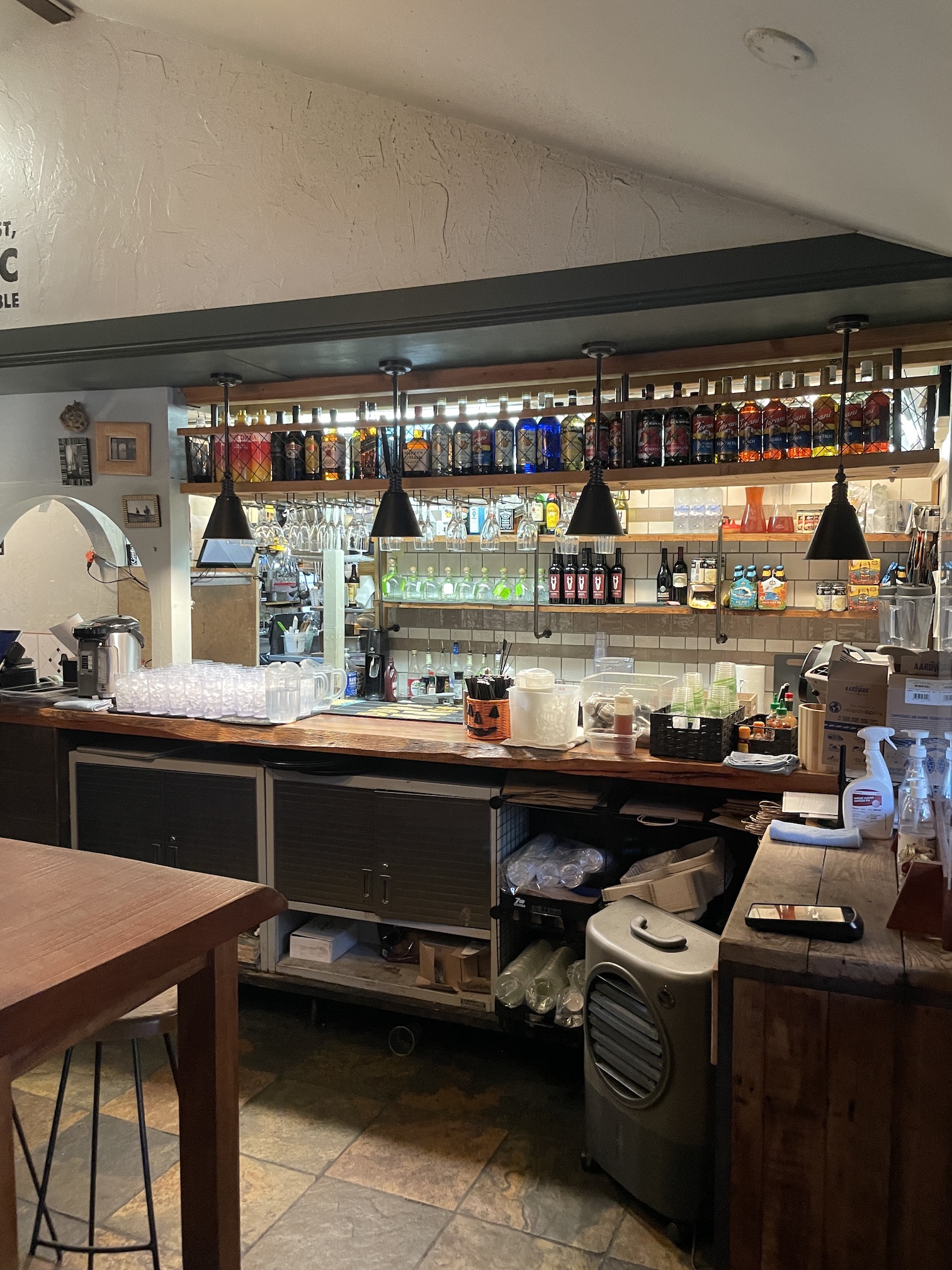 Goofy Cafe & Dine | Breakfast Review Hawaii Calling a bar with shelves and bottles of liquid