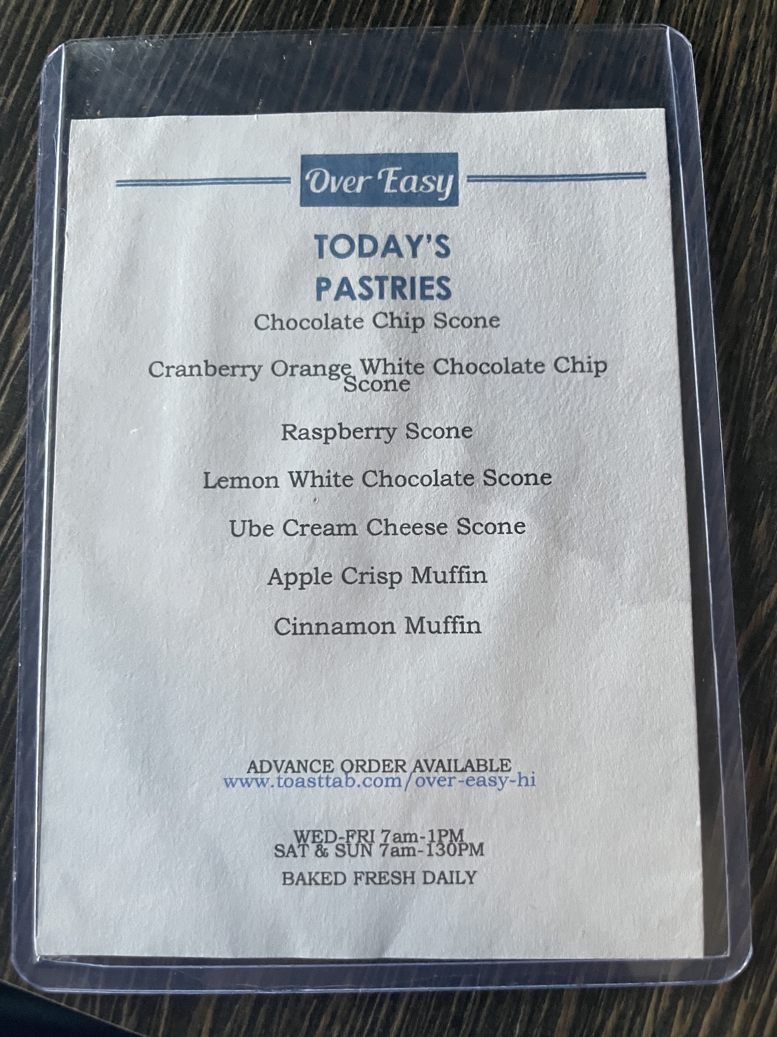 Over Easy Kailua | Breakfast Review Hawaii Calling a menu on a table