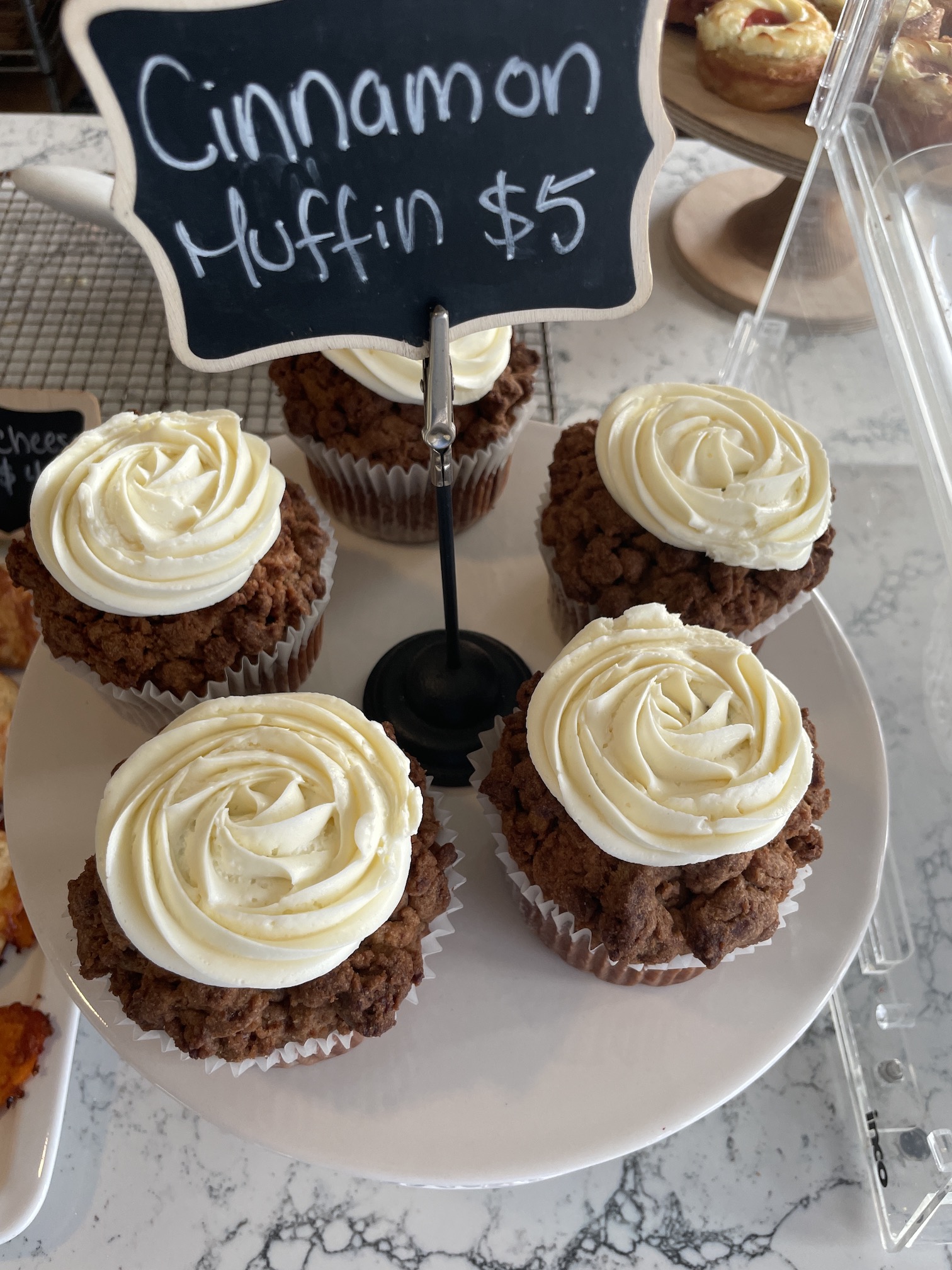 Over Easy Kailua | Breakfast Review Hawaii Calling a plate of muffins with white frosting