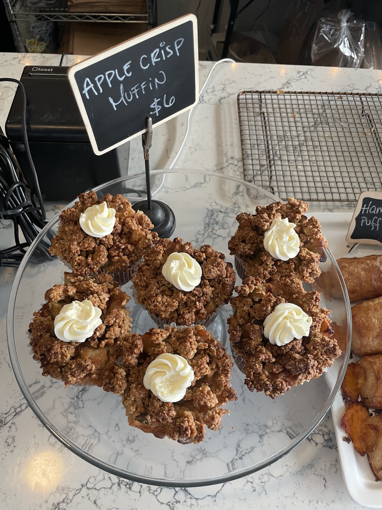 Over Easy Kailua | Breakfast Review Hawaii Calling a plate of muffins with whipped cream on top
