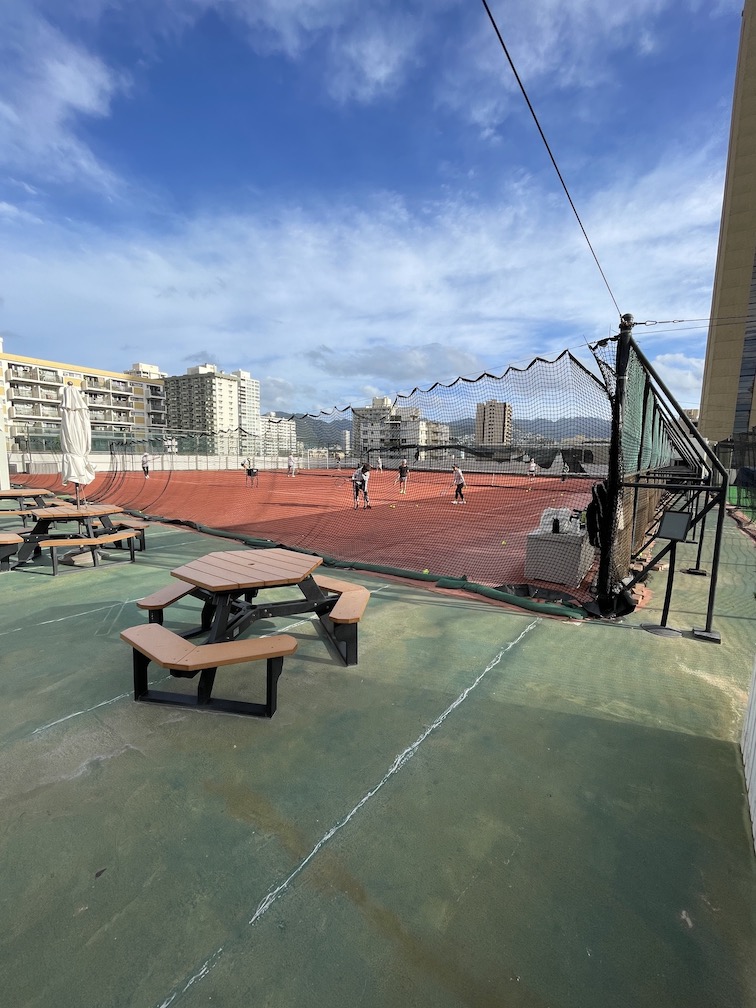 Review & Video: 'Alohilani Resort Waikiki Beach, A Unique Oasis Hawaii Calling a tennis court with benches and tables