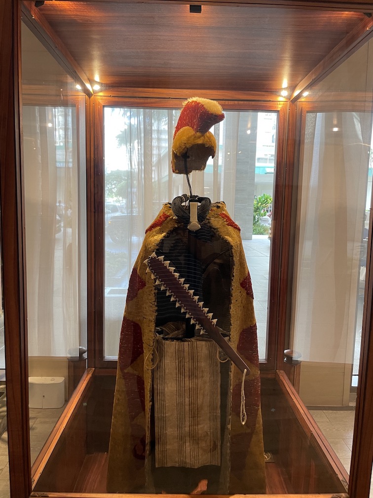 Review & Video: 'Alohilani Resort Waikiki Beach, A Unique Oasis Hawaii Calling a display case with a sword and a hat