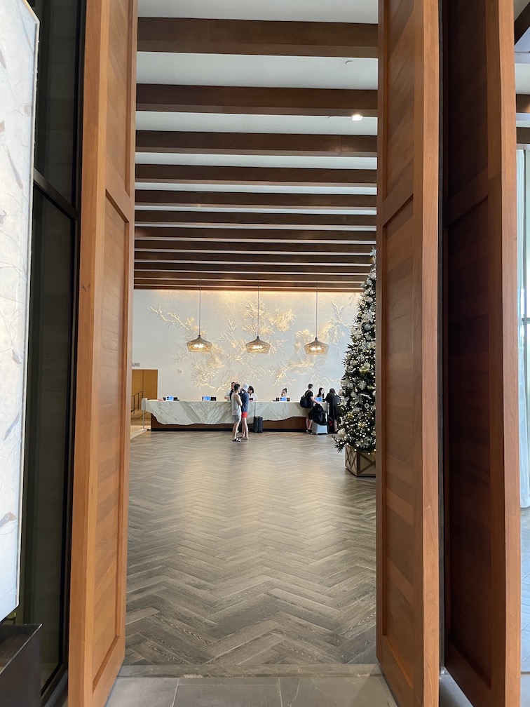 Review & Video: 'Alohilani Resort Waikiki Beach, A Unique Oasis Hawaii Calling a room with a christmas tree and people