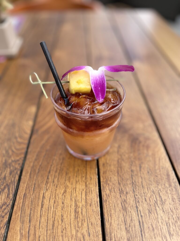 Review & Video: 'Alohilani Resort Waikiki Beach, A Unique Oasis Hawaii Calling a drink with a flower on top