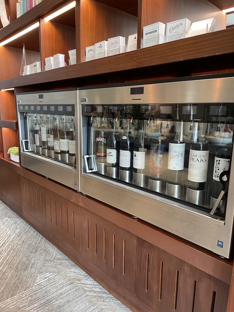 Review & Video: 'Alohilani Resort Waikiki Beach, A Unique Oasis Hawaii Calling a display of wine bottles in a glass case
