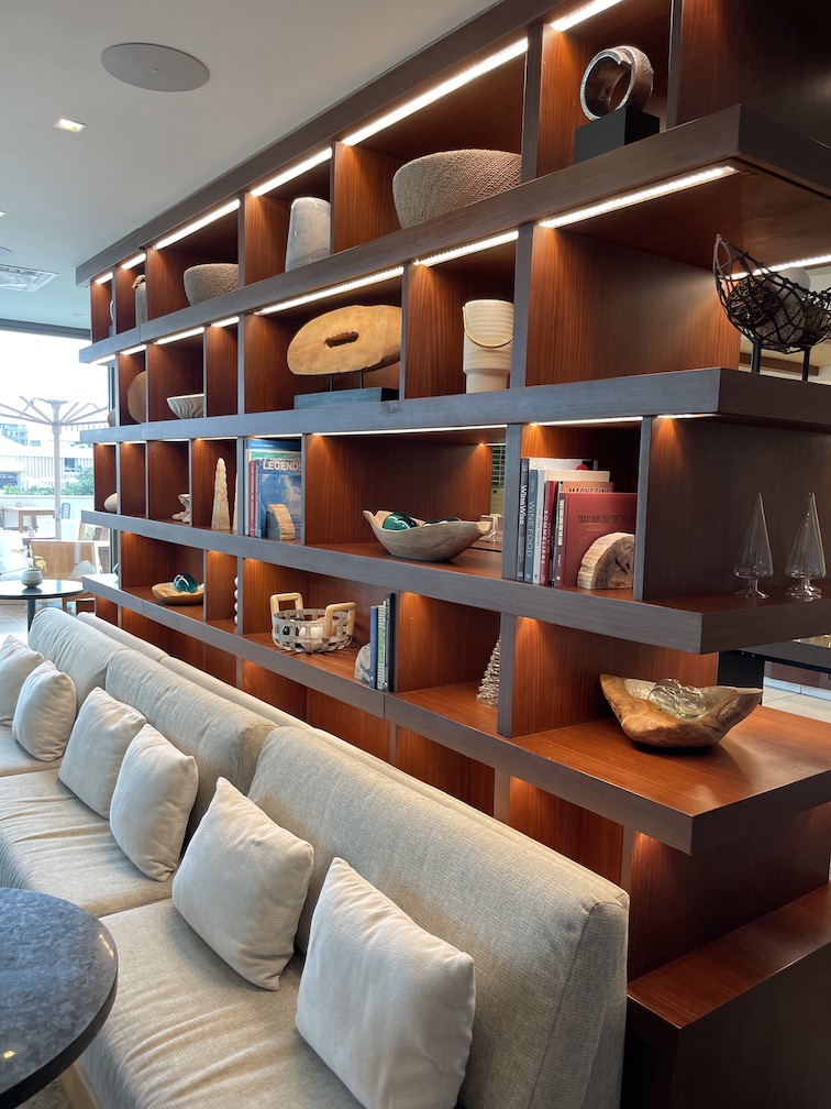 Review & Video: 'Alohilani Resort Waikiki Beach, A Unique Oasis Hawaii Calling a shelf with shelves and lights