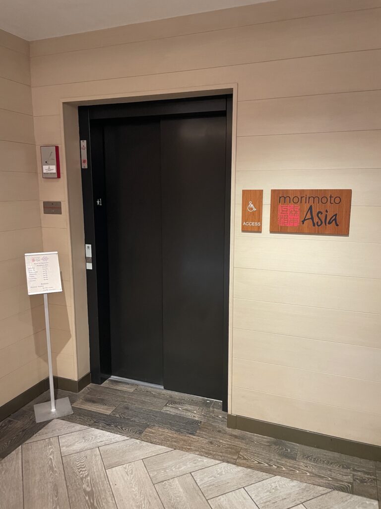 Review & Video: 'Alohilani Resort Waikiki Beach, A Unique Oasis Hawaii Calling a elevator door with a sign on the wall