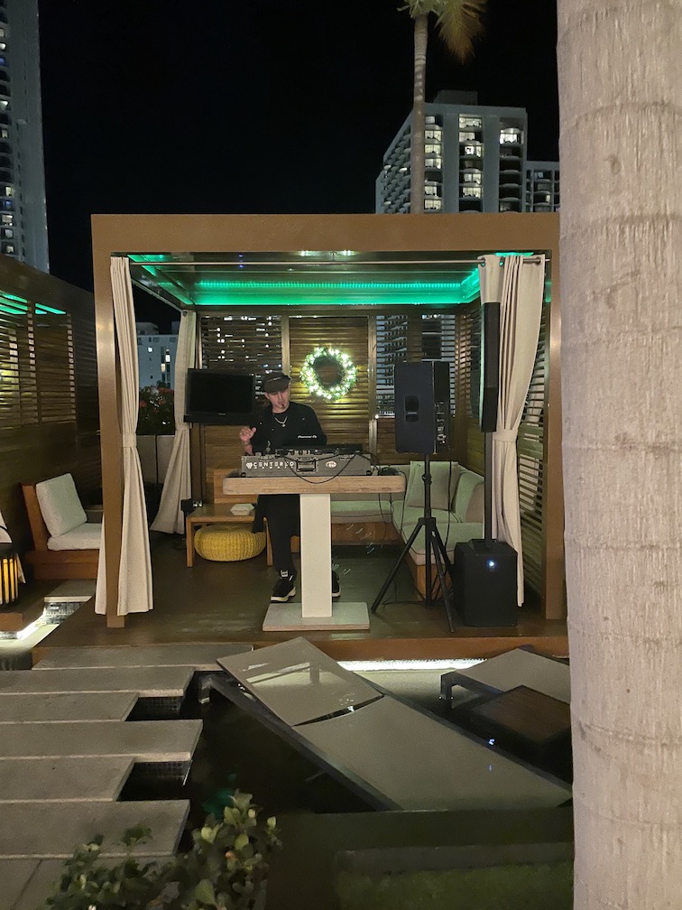 Review & Video: 'Alohilani Resort Waikiki Beach, A Unique Oasis Hawaii Calling a man playing music on a deck