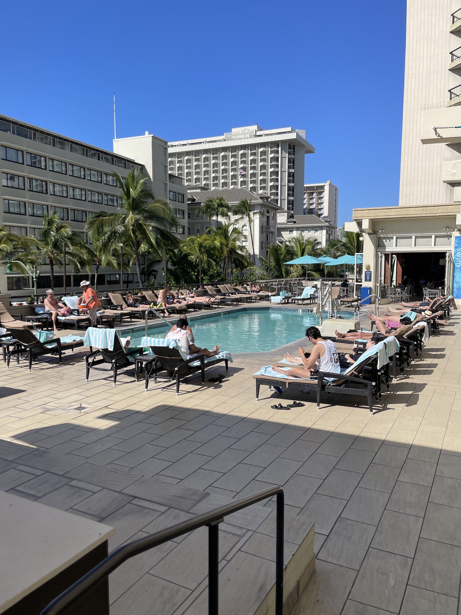 Review: Hyatt Regency Waikiki, Amazing With An Achilles Heel Hawaii Calling a pool with people sitting in chairs