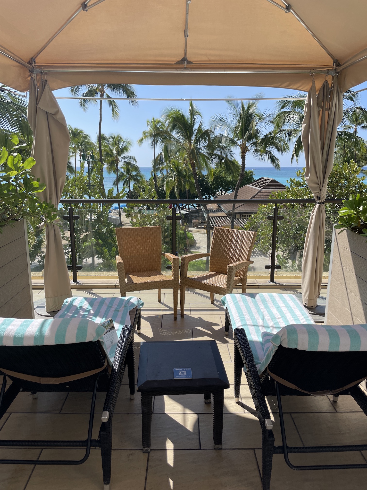 Review: Hyatt Regency Waikiki, Amazing With An Achilles Heel Hawaii Calling a deck with chairs and a table