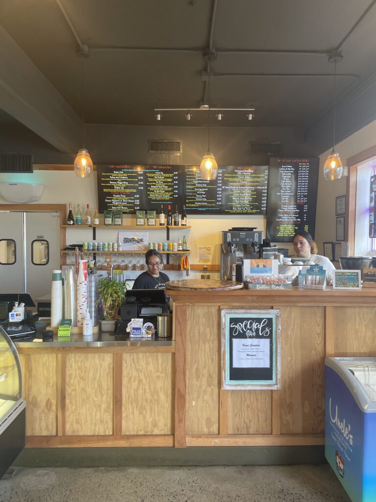 Review: Kalapawai Waimanalo | Extra Fresh Breakfast Hawaii Calling a woman behind a counter in a coffee shop