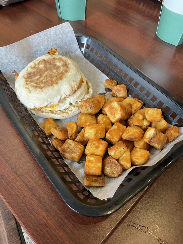Review: Kalapawai Waimanalo | Extra Fresh Breakfast Hawaii Calling a breakfast sandwich and potatoes in a basket