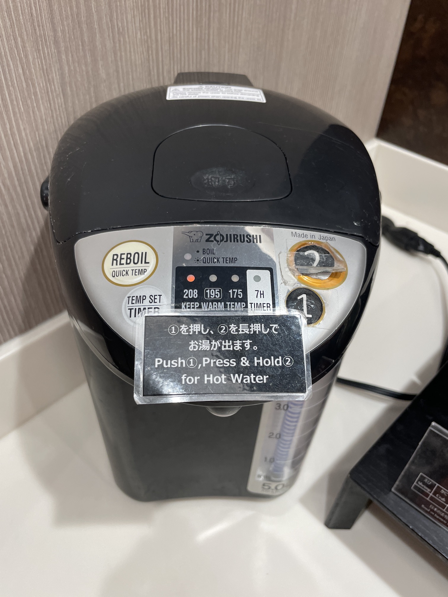 Honolulu Admirals Club | Guide & Review (2025) Hawaii Calling a black coffee maker with a label