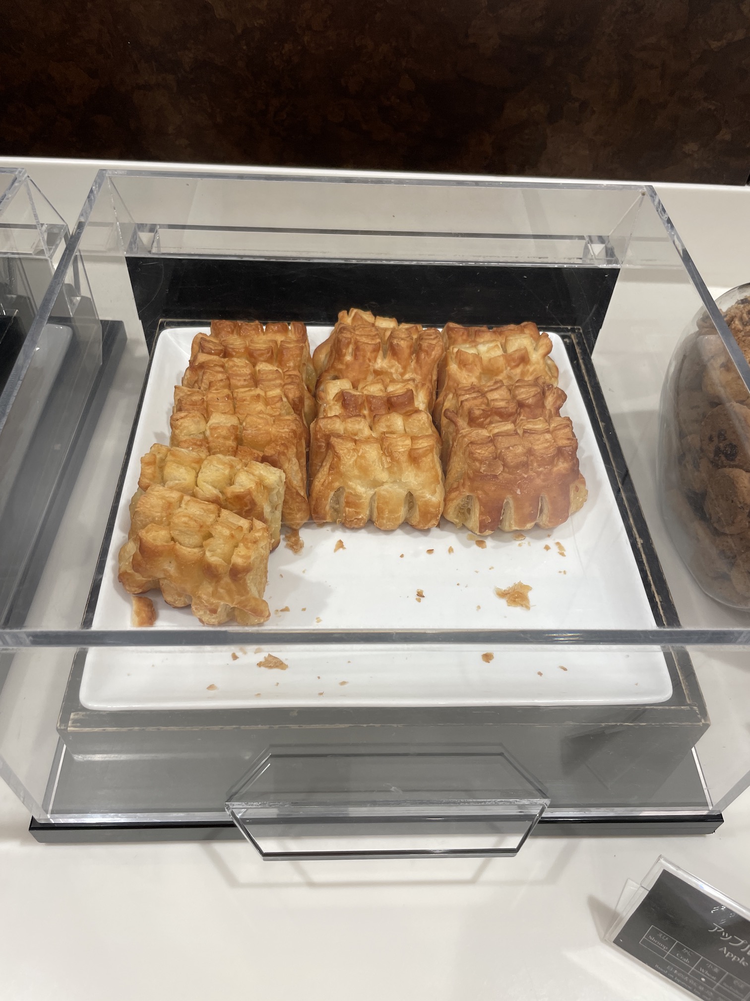 Honolulu Admirals Club | Guide & Review (2025) Hawaii Calling a tray of pastries on a counter