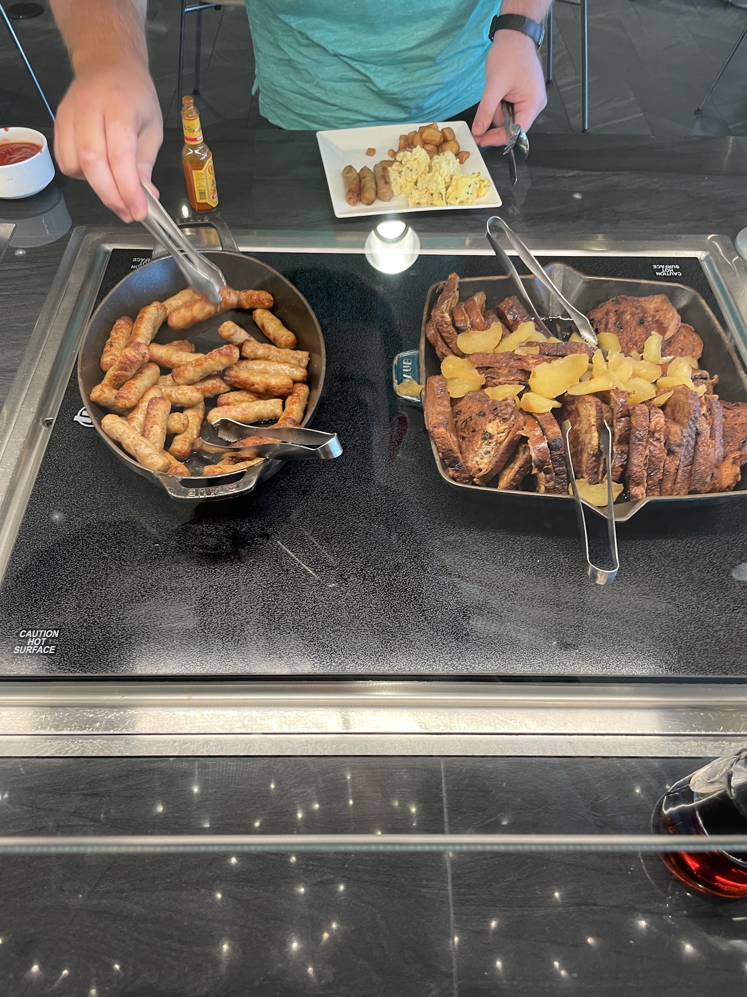 Review: American Express Centurion Lounge Phoenix - Small & Efficient Hawaii Calling a pans of food on a counter