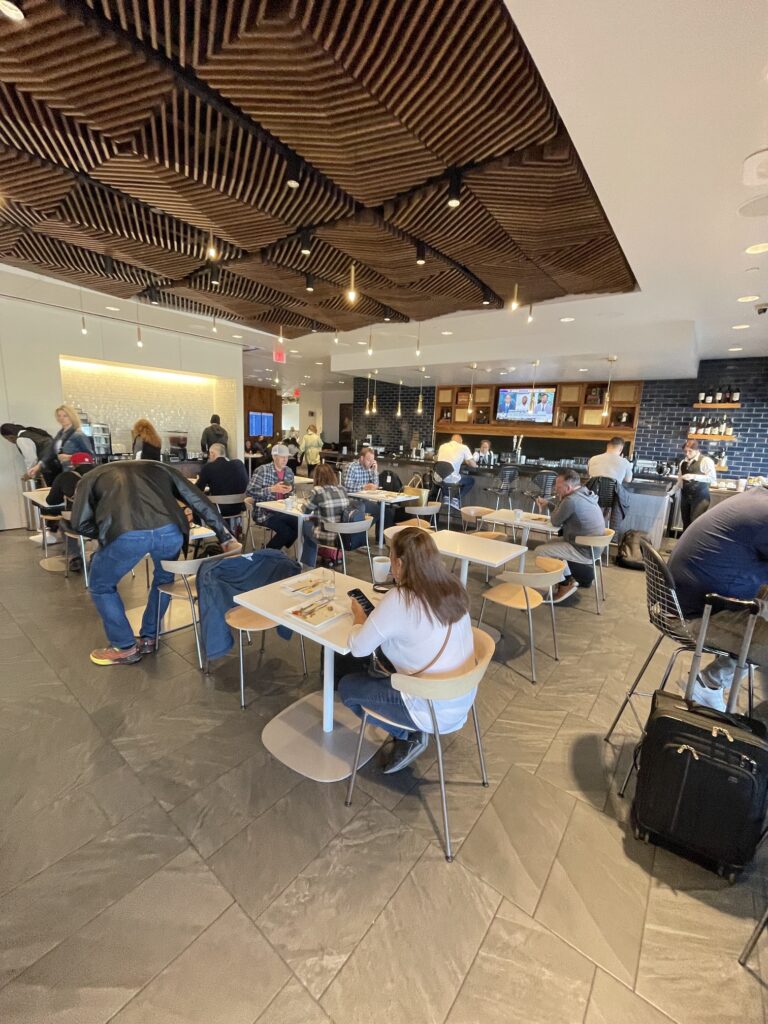 Review: American Express Centurion Lounge Phoenix - Small & Efficient Hawaii Calling a group of people sitting at tables in a restaurant