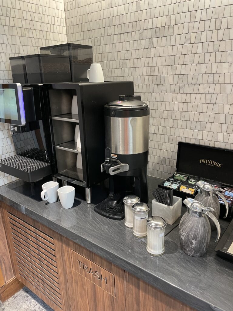 Review: American Express Centurion Lounge Phoenix - Small & Efficient Hawaii Calling a coffee machine and coffee maker on a counter
