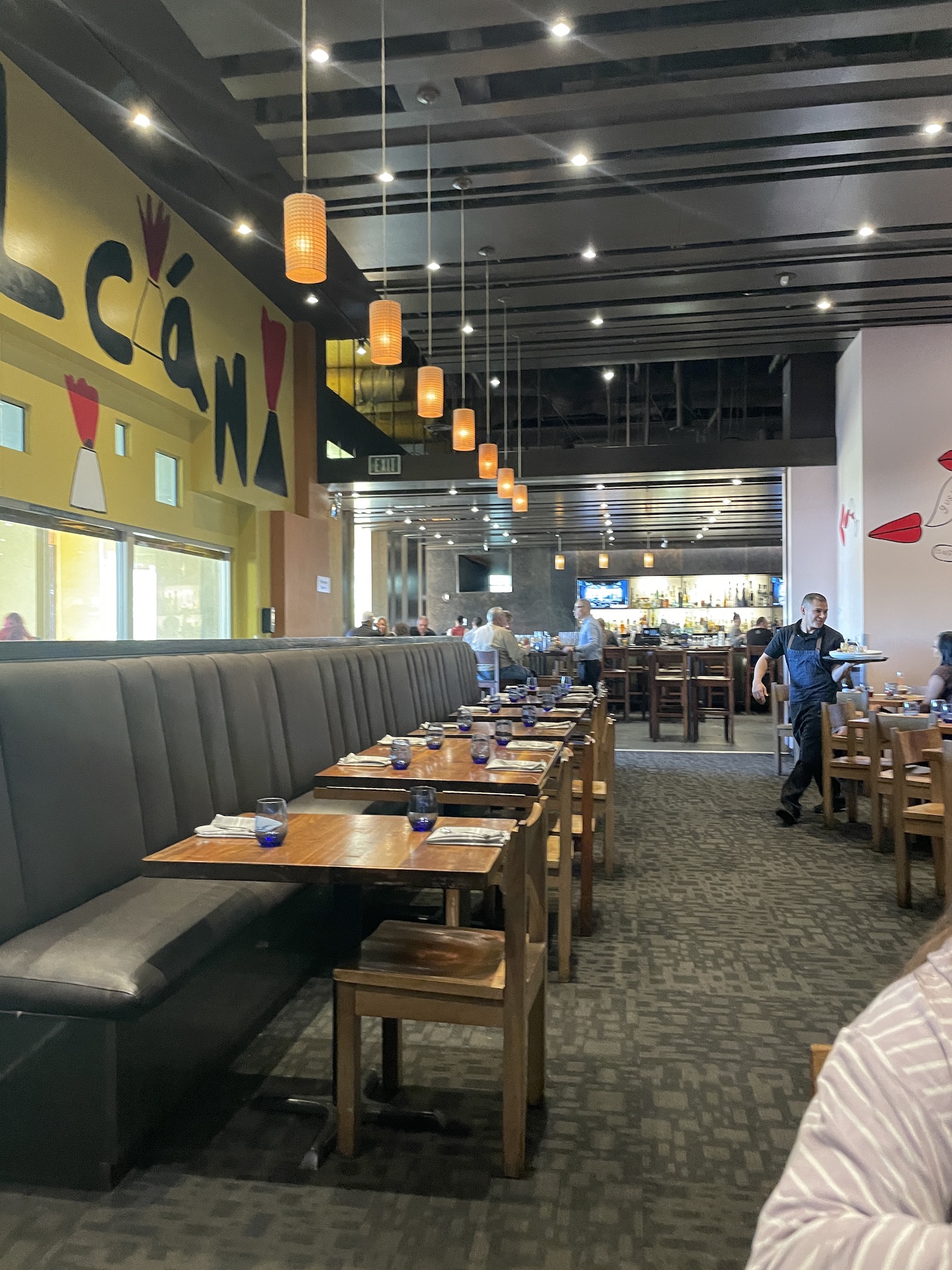 Review: Amazing Border Grill Buffet Las Vegas Hawaii Calling a long booth seating with tables and chairs in a restaurant