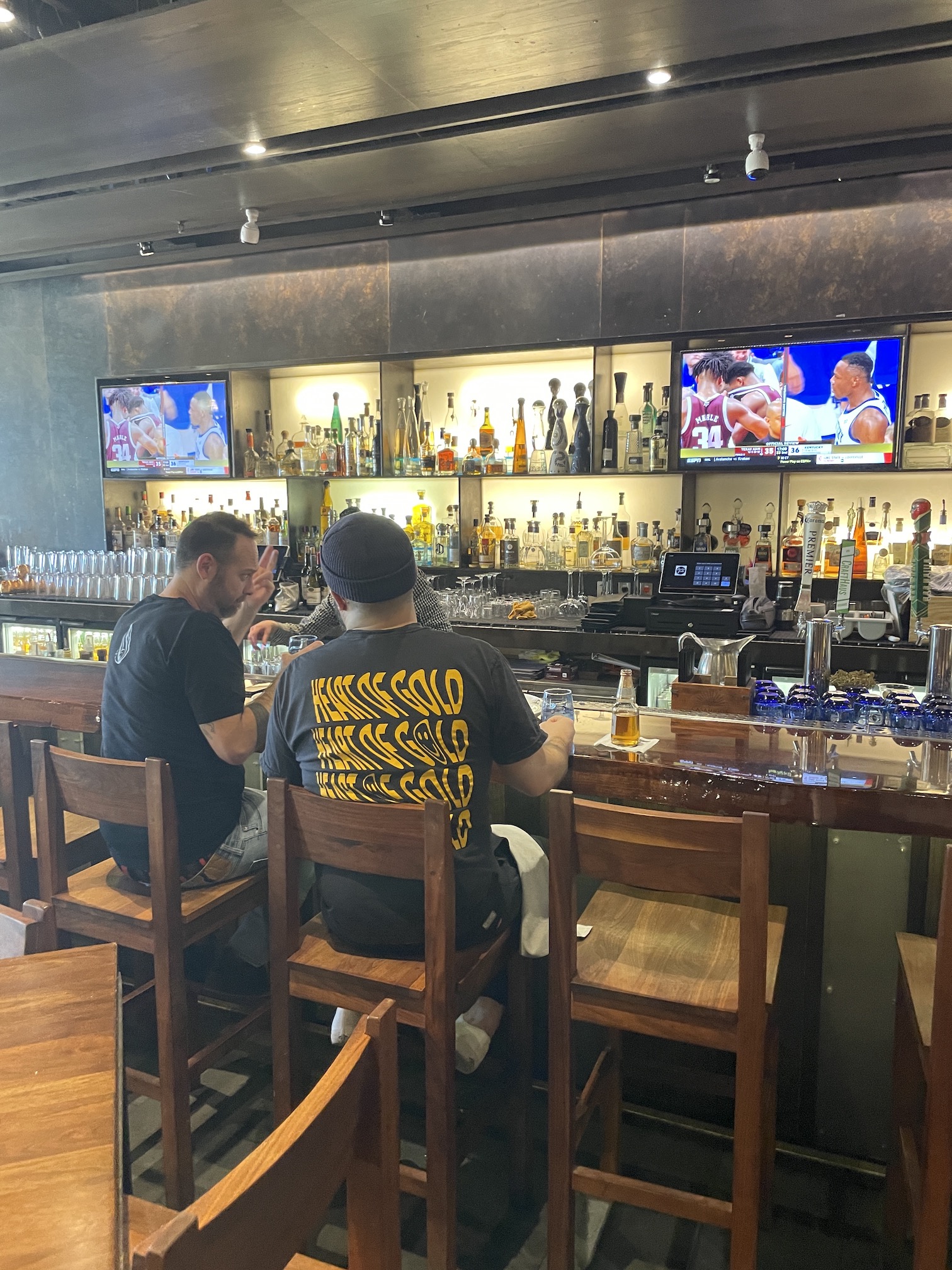 Review: Amazing Border Grill Buffet Las Vegas Hawaii Calling two men sitting at a bar