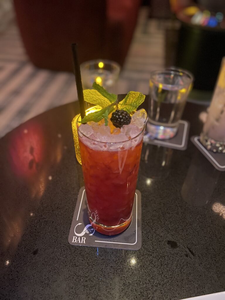 Review: Sexy Sultry S Bar Las Vegas Hawaii Calling a glass of red drink with ice and berries