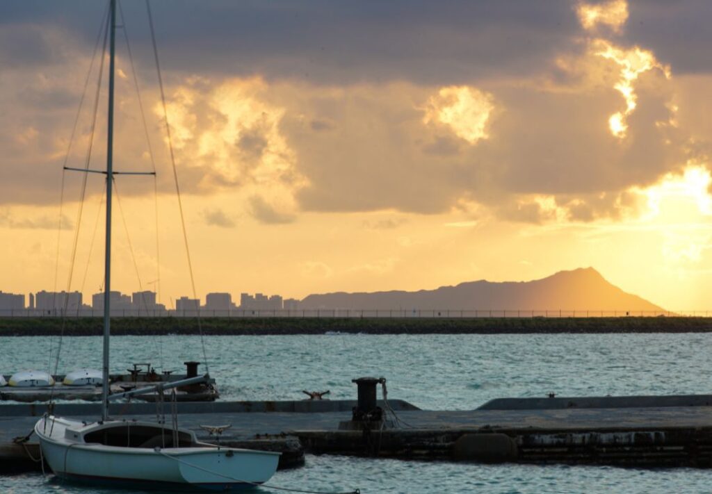 5 Best Sunrise Hikes On Oahu | (2025) Hawaii Calling a boat on a dock in the water