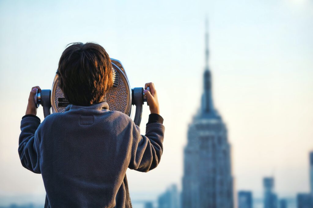How to Spot a Great Credit Card Bonus in 2022 Hawaii Calling How to spot a great credit card bonus. Child looking at empire state building through fixed binocular stand