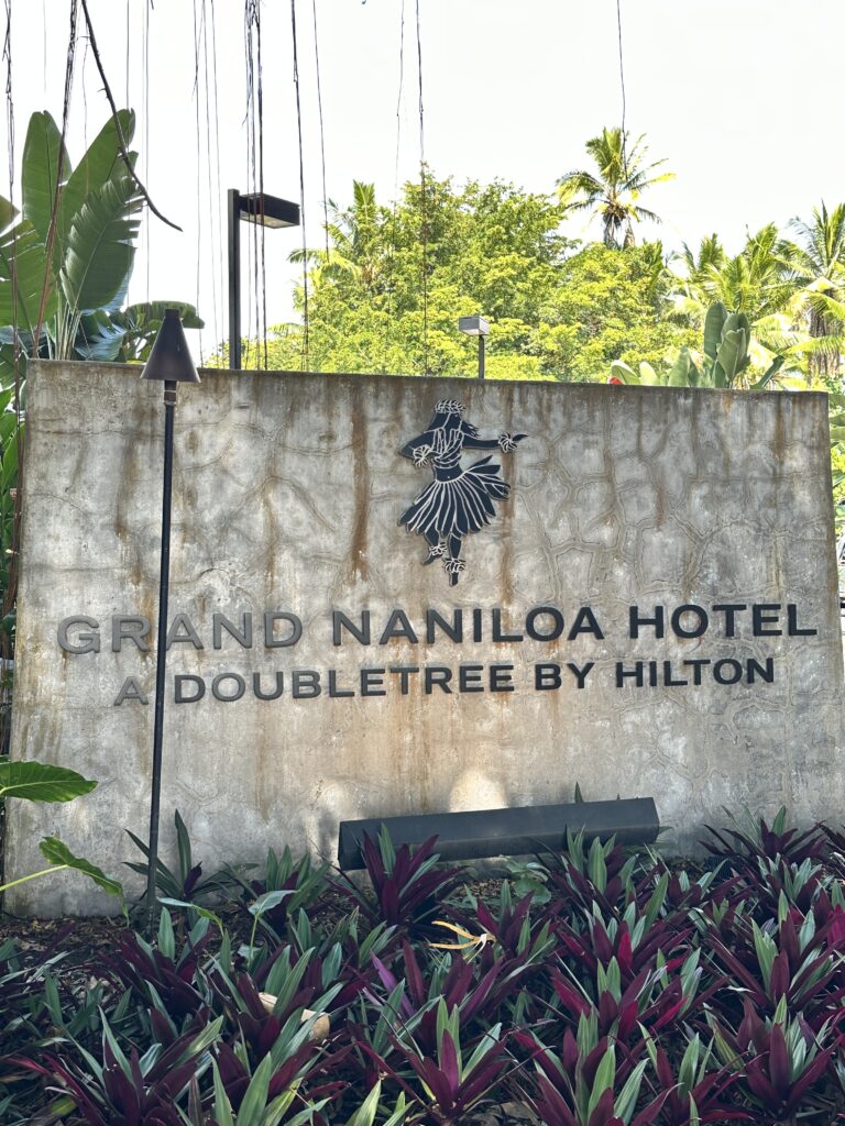5 Best Budget Friendly Hotels in Hawaii for (2025) Hawaii Calling entrance sign to the Grand Nanioloa hotel, one of the best budget hotels in Hawai'i