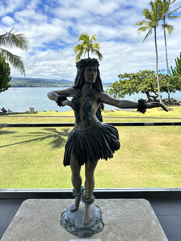 5 Best Budget Friendly Hotels in Hawaii for (2025) Hawaii Calling a statue of a woman in a skirt and grass skirt