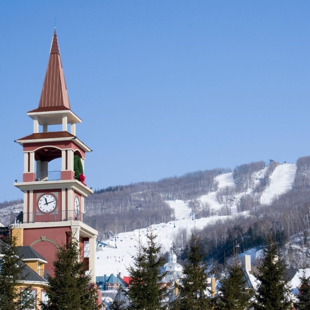 11 Best Hotels in Mont-Tremblant Canada 2022 Hawaii Calling View of the clock tower and ski runs at Mont-Tremblant