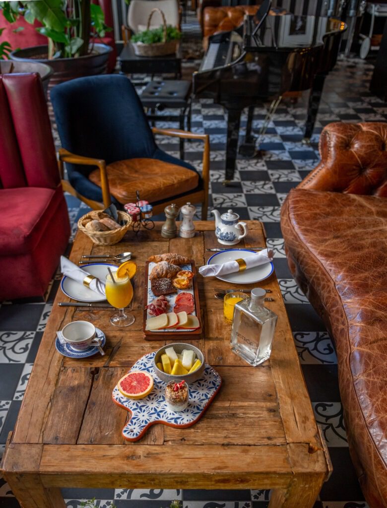 Fontecruz Lisboa an Autograph Collection Hotel, Classic Vintage Hawaii Calling a table with food on it