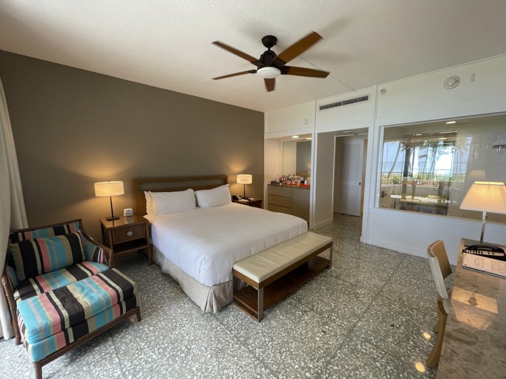 Review & Video: Mauna Kea Beach Hotel, Autograph Collection Hawaii Calling a room with a bed and a chair