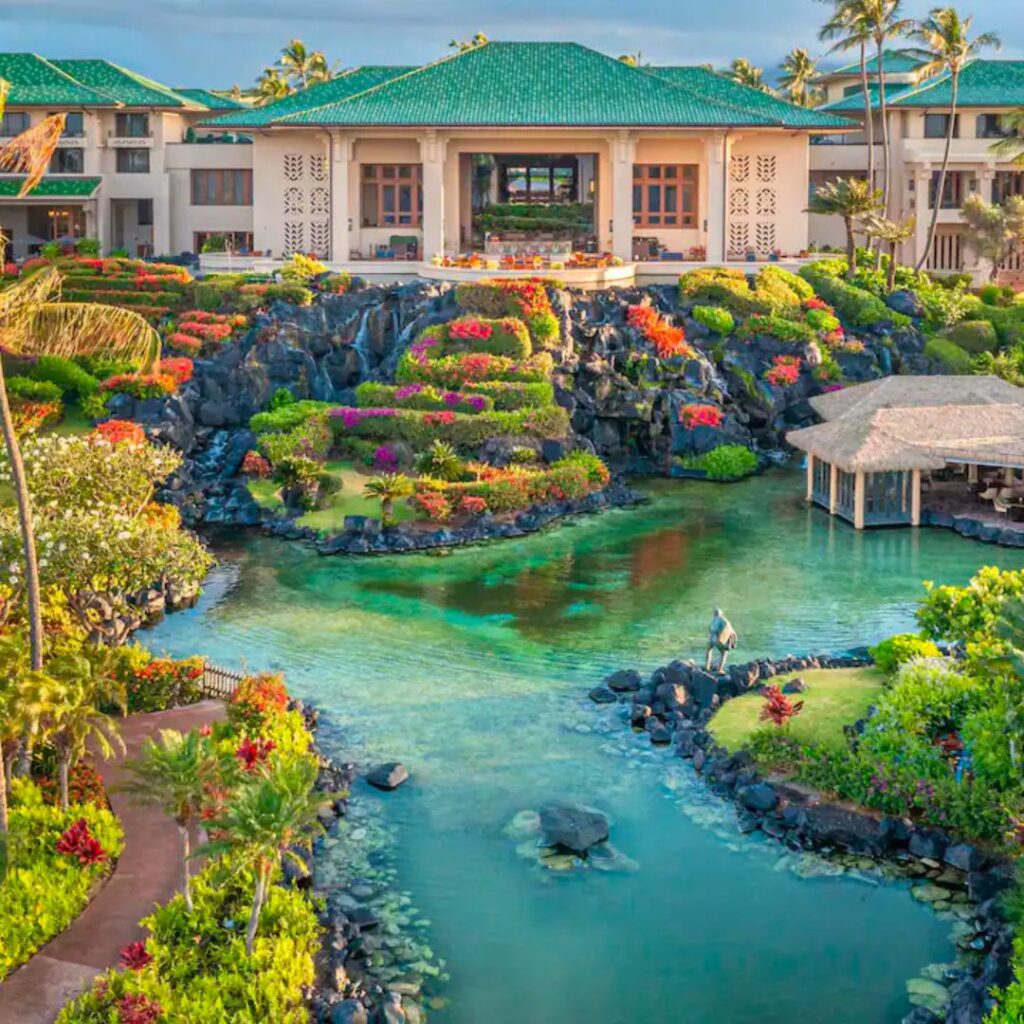 5 Best Luxury Hotels on Kauai (2025) Hawaii Calling a building with a pool and a large building with a pool and trees