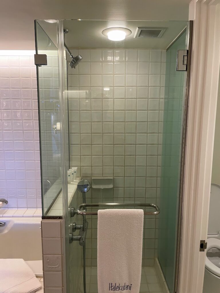 a bathroom with a glass shower door