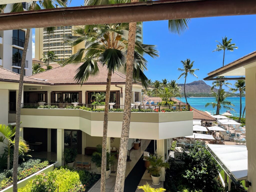 a building with a balcony and a body of water