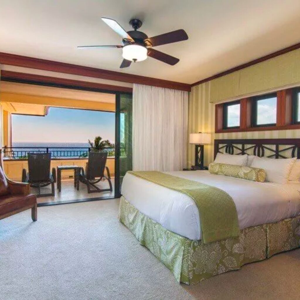 5 Best Luxury Hotels on Kauai (2025) Hawaii Calling a bedroom with a large bed and a chair