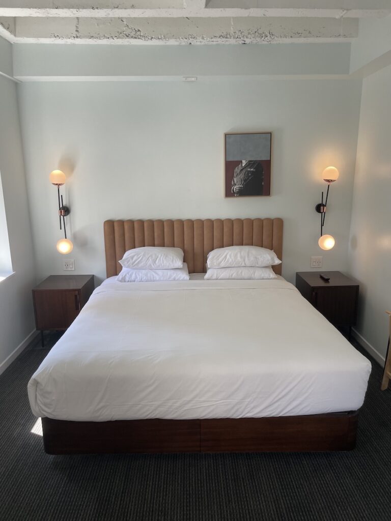 Review & Video: The Guild Hotel, San Diego, a Tribute Portfolio Hotel Hawaii Calling a bed with white sheets and brown headboard