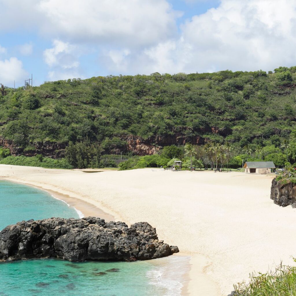 The Perfect Oahu 7 Day Budget Itinerary 2023 Hawaii Calling a beach with rocks and trees