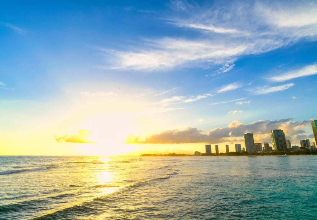 10 Best Sunset Spots On Oahu Hawaii Calling a body of water with a city in the background