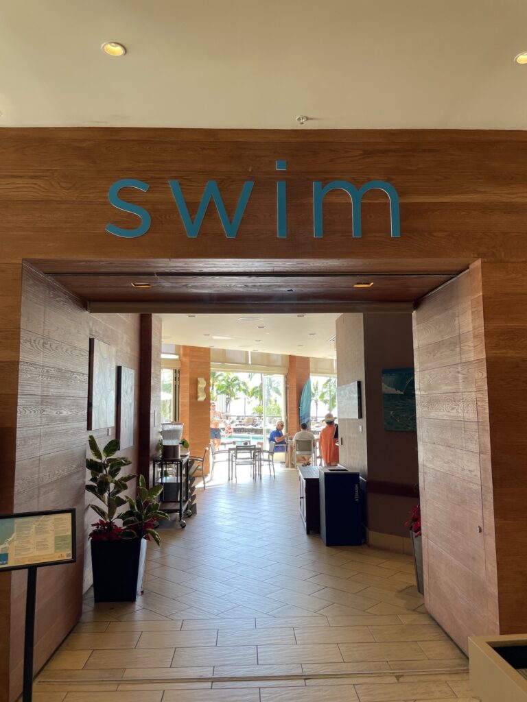 Review: Hyatt Regency Waikiki, Amazing With An Achilles Heel Hawaii Calling a wood doorway with blue text