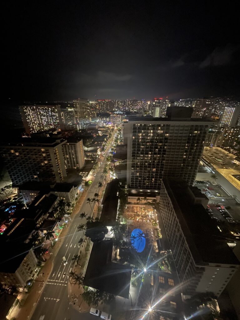 Review: Hyatt Regency Waikiki, Amazing With An Achilles Heel Hawaii Calling a city at night with many tall buildings