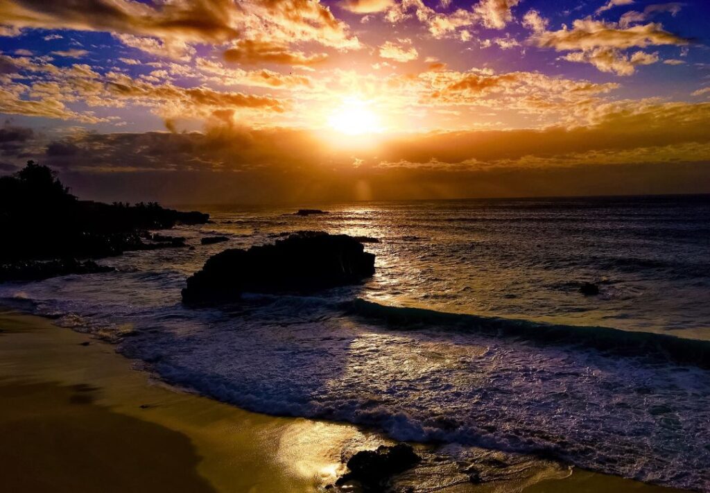 10 Best Sunset Spots On Oahu Hawaii Calling a sunset over a beach
