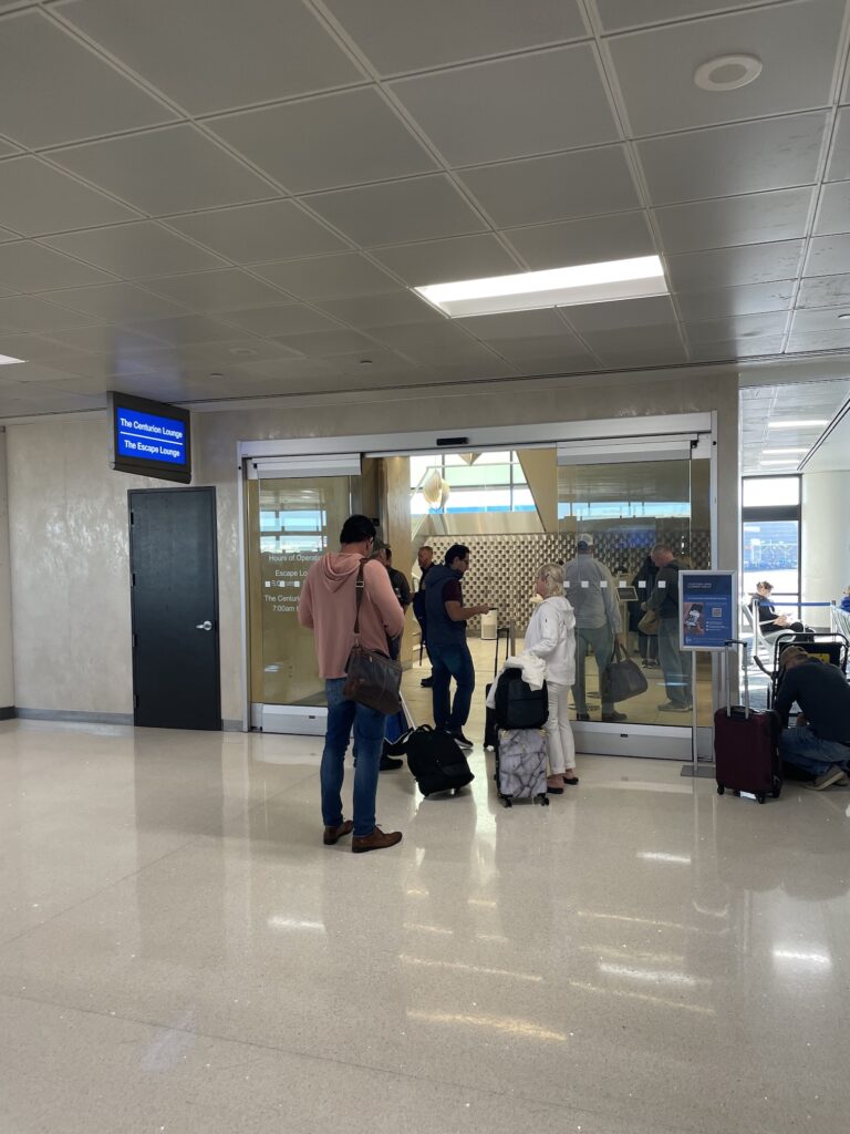 Review: American Express Centurion Lounge Phoenix - Small & Efficient Hawaii Calling a group of people standing in a room with luggage