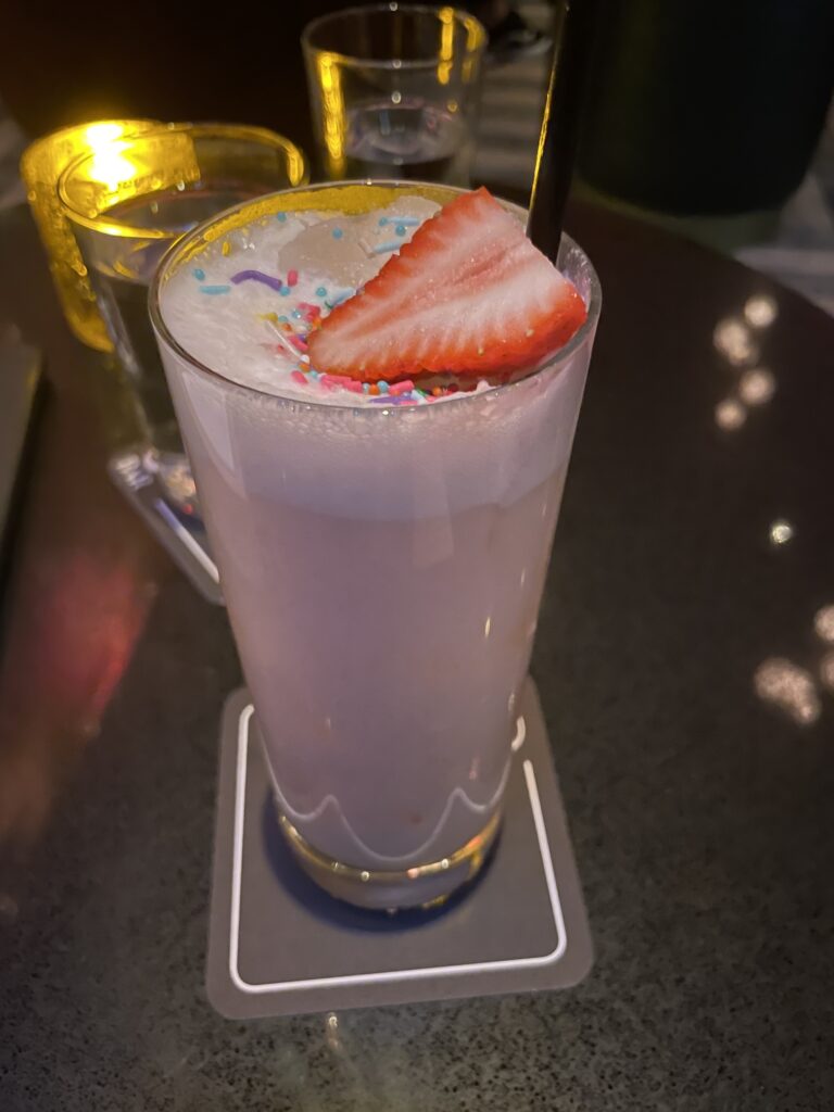 Review: Sexy Sultry S Bar Las Vegas Hawaii Calling a glass of milkshake with a strawberry slice on top