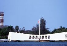 Your Complete Guide To Visiting Pearl Harbor (2026) a group of people on a boat