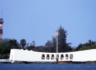 Your Complete Guide To Visiting Pearl Harbor (2026) a group of people on a boat