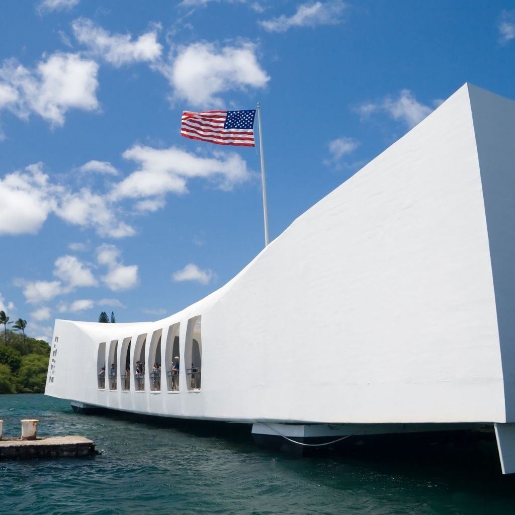 Your Complete Guide To Visiting Pearl Harbor Hawaii Calling a white building with a flag on the top