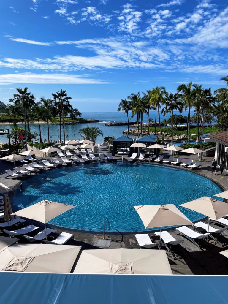 Review & Video: Four Seasons Oahu at Ko Olina, Pinnacle of Luxury Hawaii Calling a pool with umbrellas and chairs around it