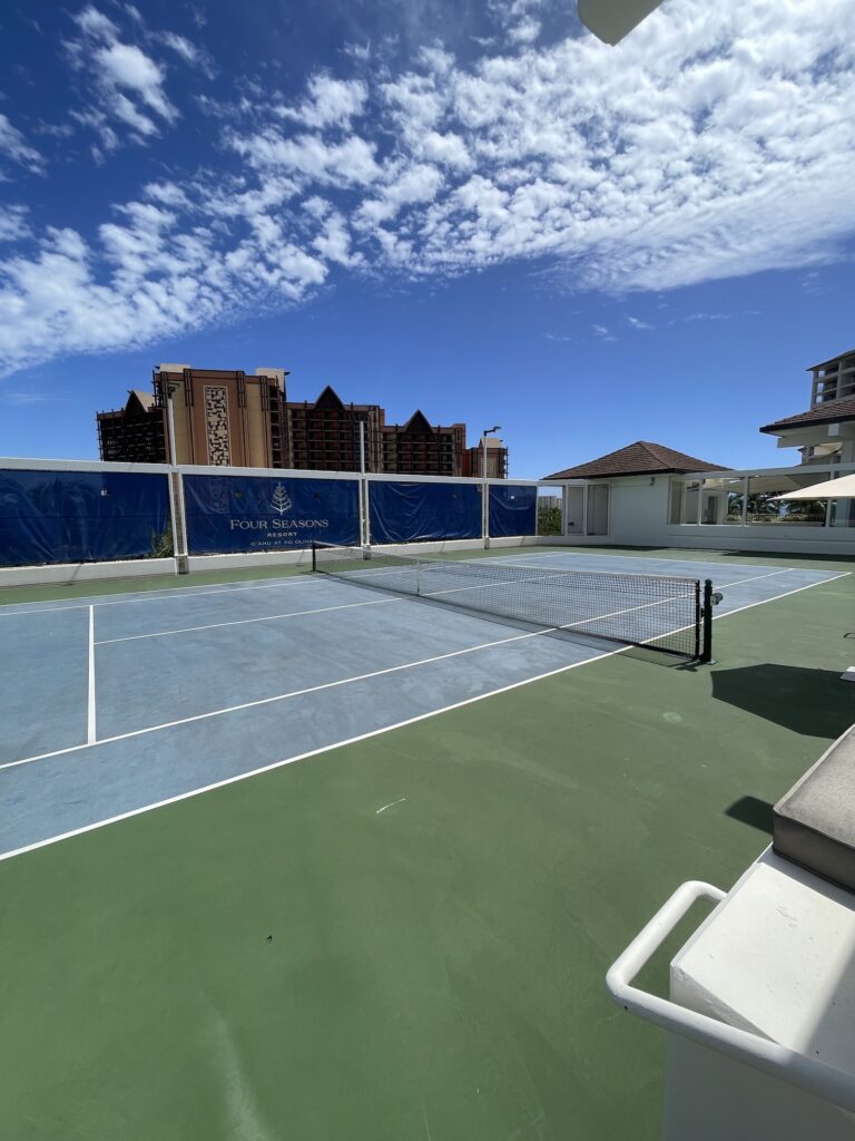 Review & Video: Four Seasons Oahu at Ko Olina, Pinnacle of Luxury Hawaii Calling a tennis court with a net and chairs on a sunny day