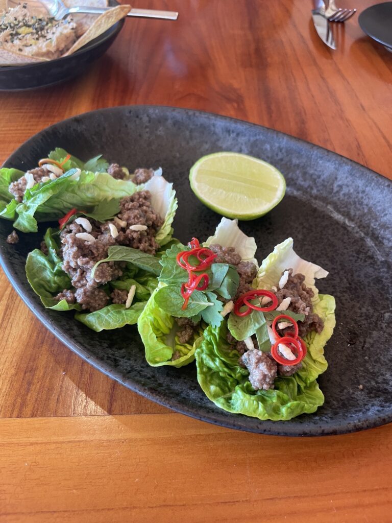 Review & Video: Four Seasons Oahu at Ko Olina, Pinnacle of Luxury Hawaii Calling a plate of lettuce wraps with meat and a lime wedge